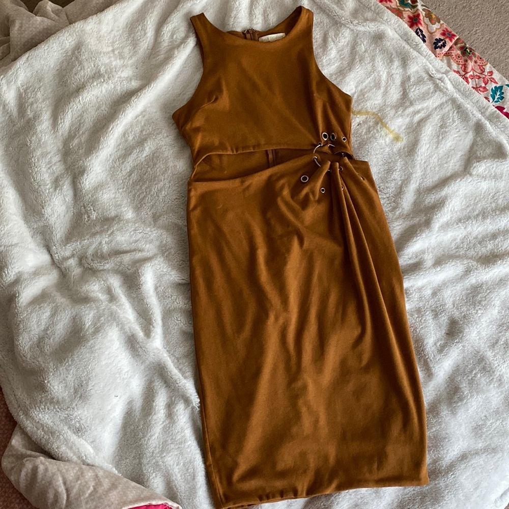 Brown Mini dress with an open midriff and detailing on the side hip!
